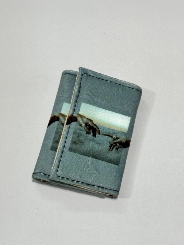 2024_11_26_16_42_IMG_4039 کیف پول جیبی طرح دست داووینچی - تصویر 1